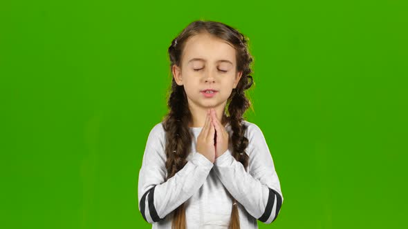 Child Crosses His Fingers in His Arms. Green Screen