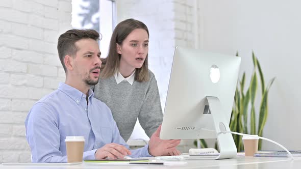 Disappointed Startup Team Reacting To Failure on Desktop