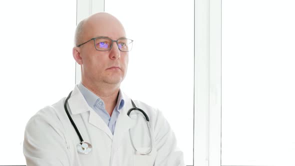 Confident Doctor in Eyeglasses Nodding Head