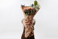 Lady's hands hold a nice bouquet from fresh fragrant flowers living coral colored roses on a - PhotoDune Item for Sale