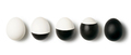 White and black colored eggs on a white background with copy space. Concept of changing life. Flat - PhotoDune Item for Sale