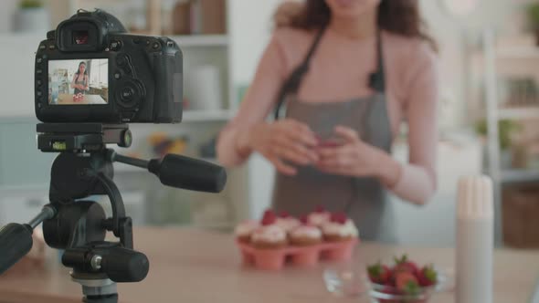 Blurred Woman Being Filmed on Camera