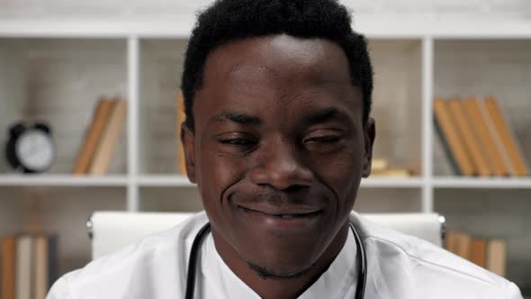 Close Up Smiling Face African American Man Doctor Looking Camera in Hospital