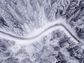 Straight down view of stream meandering through frozen, snow cov - PhotoDune Item for Sale