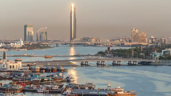 Dubai Creek Landscape Timelapse with Boats and Ship in Port and Modern Buildings in the Background