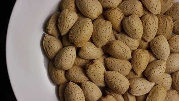 Cinematic, rotating shot of almonds on a white surface - ALMONDS 111