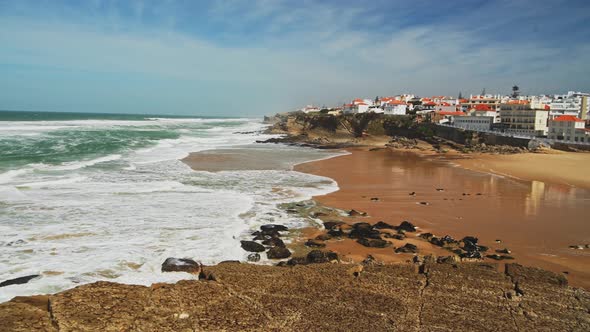 Aerial Drone View of Sandy Beach at Lisbon, Portugal at Praia das Macas, a Beautiful Coastal Town on