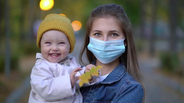 Masked Mother Holds Hand Lovely Daughter on Street Walk During Second Wave Quarantine Coronavirus