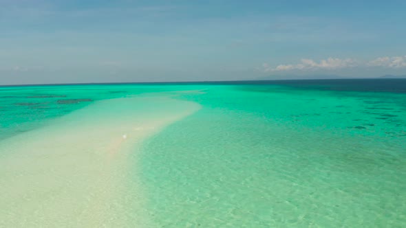 Sandy Beach in the Lagoon with Turquoise Water