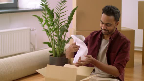 Indian Man Packing Boxes and Moving To New Home 32