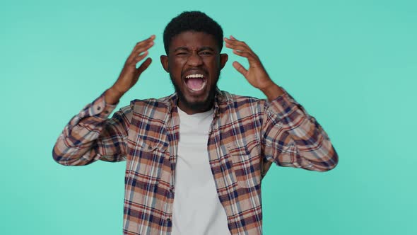 Young Mad Angry Displeased African American Man Raising Hands in Indignant Expression Quarreling