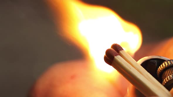 Matches ignited and its flame shot in super slow motion