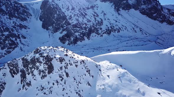 A Group of Climbers Is Walking in the Mountains