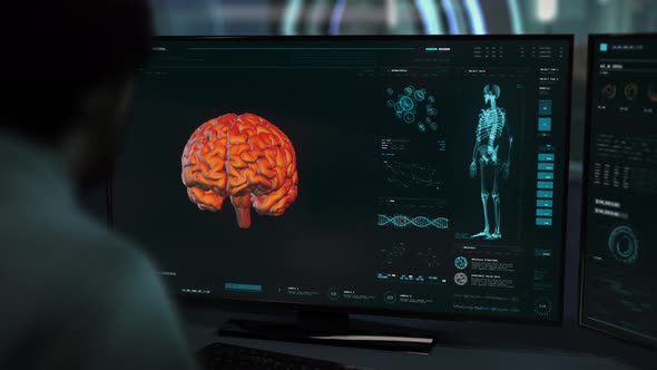 A Doctor is studying the brain tumor using the modern scanner system interface alt