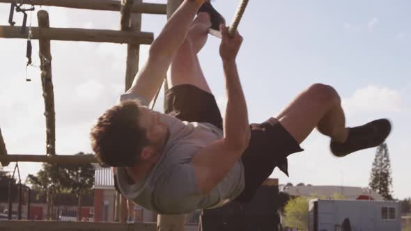 Young adults training at an outdoor gym bootcamp