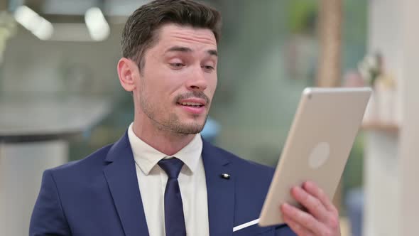 Businessman Doing Video Call on Digital Tablet 