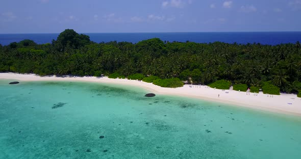 Beautiful birds eye abstract shot of a paradise sunny white sand beach and aqua blue water background