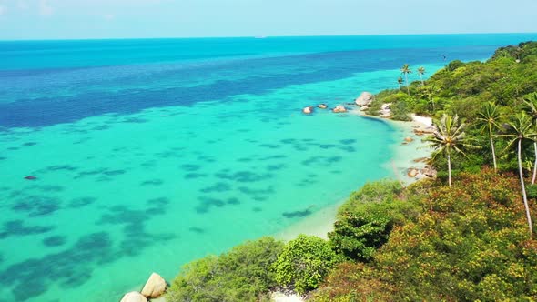 Aerial drone travel of paradise tourist beach vacation by turquoise ocean and bright sand background