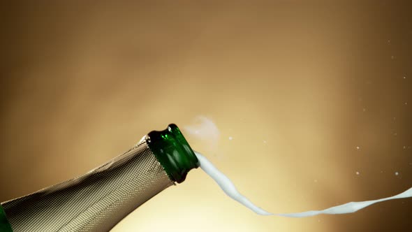 Super Slow Motion Shot of Champagne Explosion on Golden Luxury Background at 1000Fps