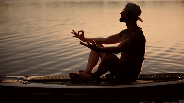 Tourist Meditation Pose Sup Board On Vacation.Standup Paddle Board.Cross-Legged No Stress Leisure