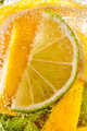 In a clear glass mint leaf, slices of lime and lemon with bubbles. Macro photo of summer drink - PhotoDune Item for Sale