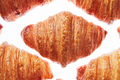 Close up pattern fresh french croissants on a white background - PhotoDune Item for Sale
