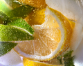 Macro photo of fresh lime and lemon slices with bubbles in the glass. Summer cold drink - PhotoDune Item for Sale