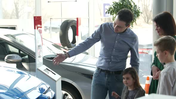 Mother Father and Child Buying Car at Dealership a New Family Auto