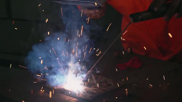 Metal Welder Working with Arc Welding Machine