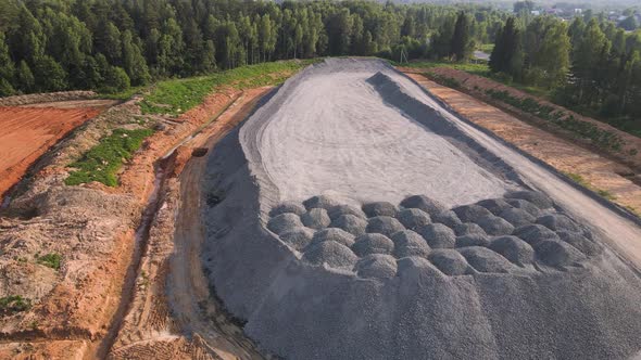 Aerial View of a Large Mountain of Stockpiled Granite Rubble