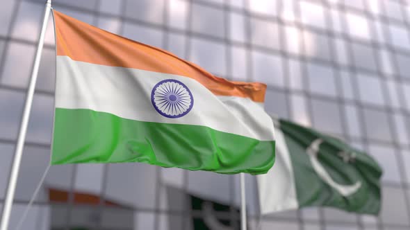 Flags of India and Pakistan in Front of a Modern Skyscraper alt