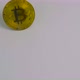 One Golden Crypto Bitcoin Coins Stands on the White Table - VideoHive Item for Sale