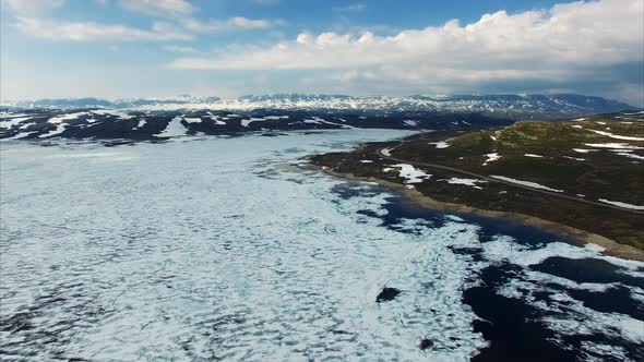 Tourist road passing through mountain pass Hardangervidda in Norway.