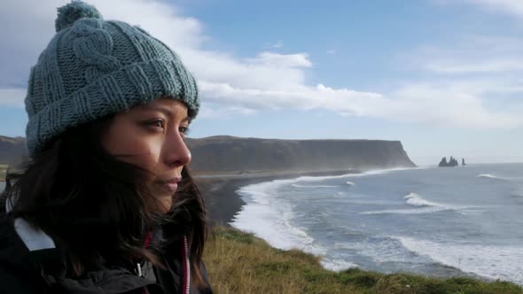 Close Up Of Woman With Ocean Cliff Backdrop