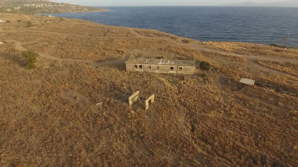 Abandoned Building In The Field Near The Sea