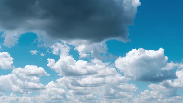 Timelapse of Light White Puffy Clouds Moving in the Blue Sky Cloud Space