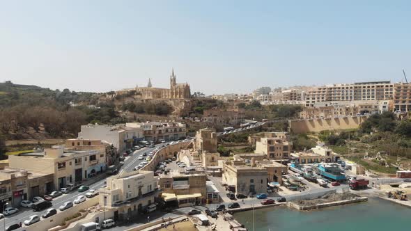 Aerial Push In Shot Towards Church of the Madonna of Lourdes in Gozo Malta