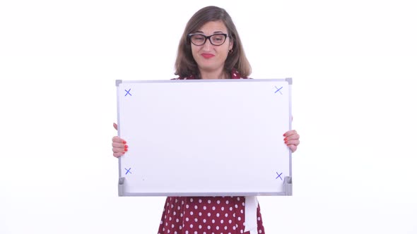 Stressed Woman with Eyeglasses Talking While Holding White Board