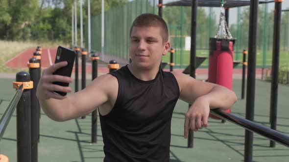 Sportsman Taking Selfie During Workout