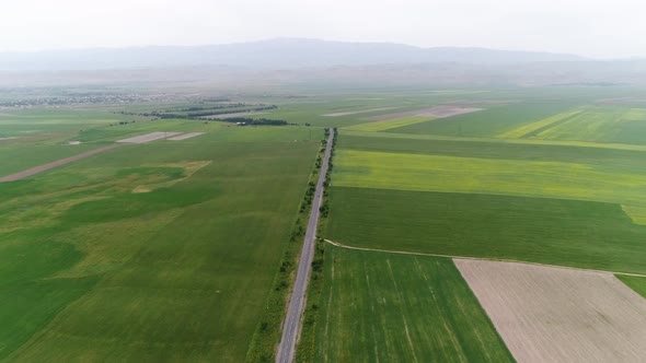 flying over fields and road