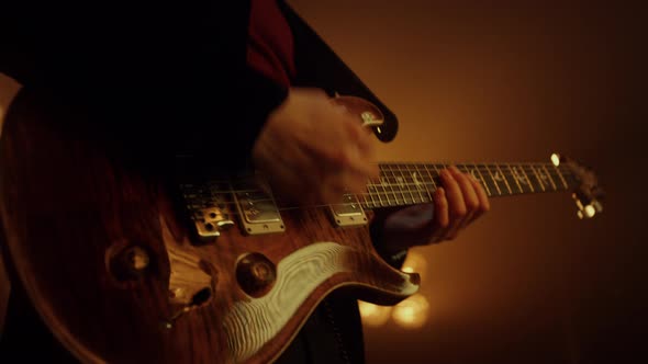 Unknown Man Hands Playing Guitar Solo in Club