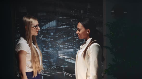 Multiracial Business Women Shaking Hands with Each Other