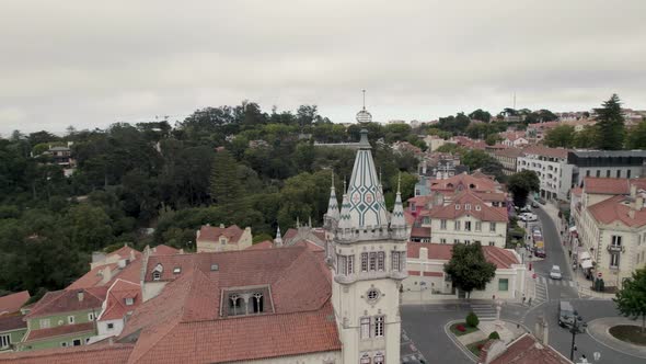 Sintra Town Hall building, tower decorated with colourful Portuguese tiles. Aerial orbiting shot.