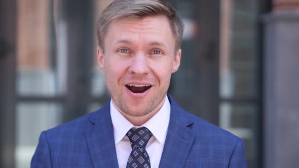 Happy Wondering Businessman Feeling Astonished