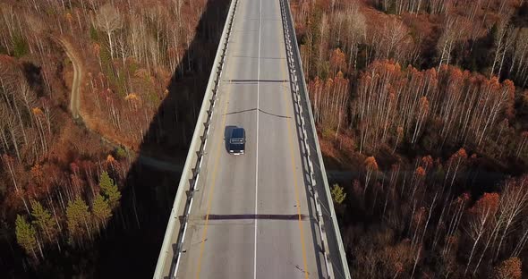 Drone Flying Above Cars Passing Over the Bridge.