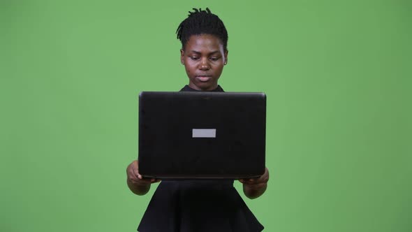 Young Beautiful African Businesswoman Using Laptop