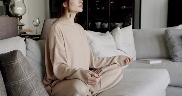 Closeup Hand of Woman Practice Yoga Lotus Pose to Meditation at Home