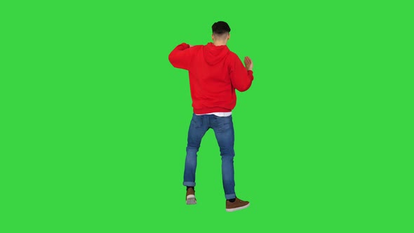 Young Man Dancing Hip-hop Doing Waves on a Green Screen, Chroma Key