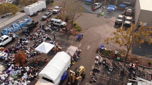 Aerial of workers loading donations at Camp Fire distribution center in California