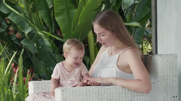 Baby Watching Mother Clapping Hands